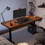 Adjustable height electric workstation with modern design and ergonomic functionality.
