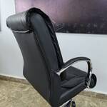 Stylish rotating leather mid-back office chair offering ergonomic support and a sleek design for any workspace.