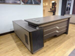 executive office desks price at Gucca Furniture Kenya. office desk, office desks, office table, office tables, office work desk, office work table, office computer desk, office computer table, office workstation desk, office writing desk, office study desk, office furniture desk, modern office desk, contemporary office desk, professional office desk, corporate office desk, commercial office desk, business office desk, executive office desk, staff office desk, manager office desk, office desk for office, office desk for home office, office desk for study, office desk for work, office desk for corporate office, office desk for companies, office desk for startups, office desk for professionals, office desk for employees, office desk for managers, office desk for executives, wooden office desk, MDF office desk, laminated office desk, metal office desk, steel office desk, glass top office desk, office desk with drawers, office desk with storage, office desk with cabinet, office desk with shelves, office desk with pedestal, office desk with filing cabinet, office desk with keyboard tray, office desk with CPU stand, office desk with cable management, L shaped office desk, straight office desk, U shaped office desk, corner office desk, compact office desk, small office desk, large office desk, minimalist office desk, ergonomic office desk, height adjustable office desk, electric office desk, sit stand office desk, fixed height office desk, office desk 120cm, office desk 140cm, office desk 160cm, office desk 180cm, office desk 200cm, office desk 240cm, office desk black, office desk white, office desk brown, office desk grey, office desk wood finish, office desk walnut finish, office desk oak finish, office desk mahogany finish, office desk for laptop, office desk for desktop, office desk for computer setup, office desk for productivity, office desk heavy duty, office desk durable, office desk scratch resistant, office desk easy maintenance, office desk modern design, office desk stylish, office desk affordable, office desk price, office desk cost, office desk for sale, buy office desk online, best office desk, office desk supplier, office desk manufacturer, office desk distributor, office desk wholesaler, office desk bulk supply, office desk wholesale Kenya, office desk furniture shop, office desk showroom, office desk Kenya, office desk Nairobi, office desk delivery Kenya, office desk installation, office desk office furniture Kenya