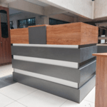 office reception desk supplier at Gucca Furniture Kenya. office reception desk, reception desk, office reception counter, reception counter desk, front office reception desk, front desk reception, office front desk, office reception table, reception desk for office, reception desk for front office, reception desk for corporate office, reception desk for business, reception desk for companies, reception desk for offices, modern reception desk, contemporary reception desk, luxury reception desk, premium reception desk, professional reception desk, corporate reception desk, executive reception desk, reception desk design, reception desk furniture, reception desk workstation, reception desk with storage, reception desk with drawers, reception desk with cabinet, reception desk with counter, reception desk with transaction top, reception desk with privacy panel, reception desk with cable management, reception desk with LED lighting, reception desk with branding panel, L shaped reception desk, straight reception desk, curved reception desk, modular reception desk, custom reception desk, large reception desk, small reception desk, compact reception desk, reception desk for small office, reception desk for large office, wooden reception desk, MDF reception desk, laminated reception desk, glass reception desk, metal frame reception desk, reception desk white, reception desk black, reception desk grey, reception desk wood finish, reception desk modern design, reception desk stylish, reception desk elegant, reception desk durable, reception desk heavy duty, reception desk scratch resistant, reception desk easy maintenance, reception desk price, reception desk cost, reception desk for sale, buy reception desk online, best reception desk, reception desk supplier, reception desk manufacturer, reception desk distributor, reception desk wholesaler, reception desk bulk supply, reception desk wholesale Kenya, reception desk furniture shop, reception desk showroom, reception desk Kenya, reception desk Nairobi, reception desk delivery Kenya, reception desk installation, office reception desk furniture Kenya, corporate reception furniture, commercial reception furniture, reception area furniture, front office furniture